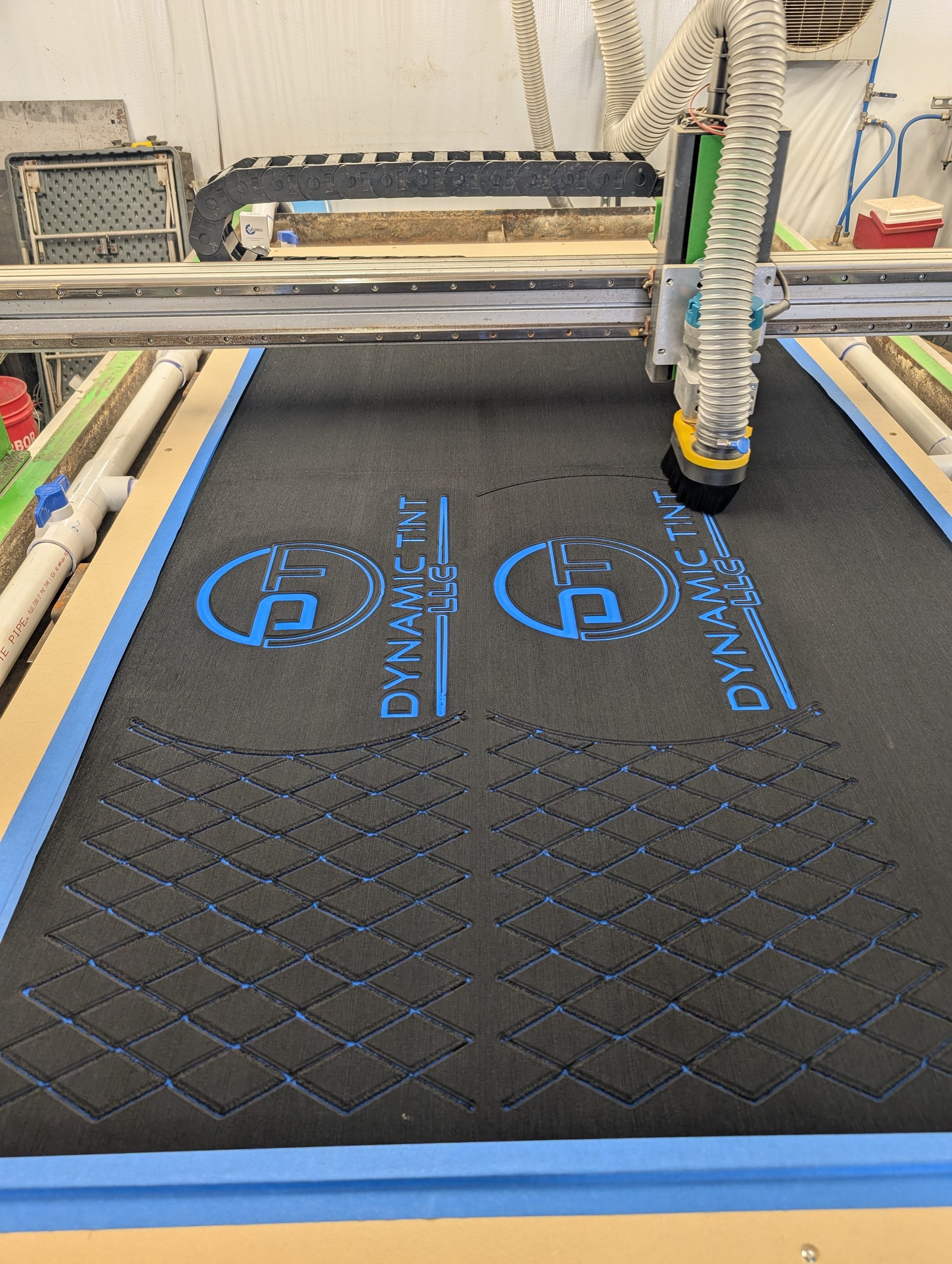 A diamond pattern being routed into a foam sheet on the CNC table